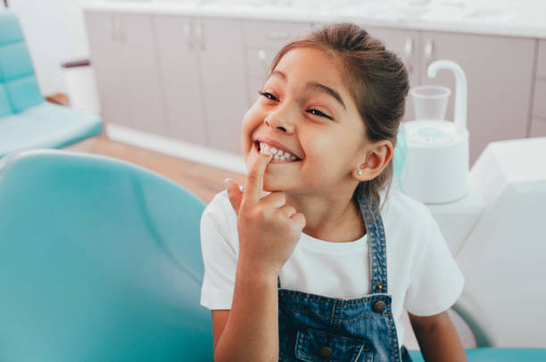 Little girl smiling in dental chair